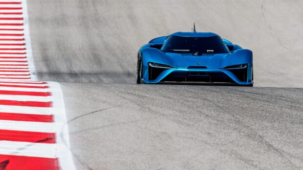 A blue Nio electric sports car drives on a racetrack with red and white markings, 4K Desktop Wallpaper
