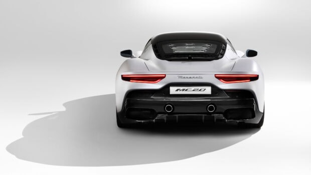 A sleek white Maserati MC20 is captured from the back with clear details of its tail lights and exhaust pipes, 4K Desktop Wallpaper
