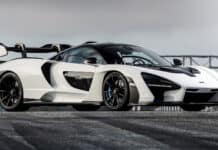 A white McLaren Senna parked on a track with a cloudy sky background, HD Desktop Wallpaper