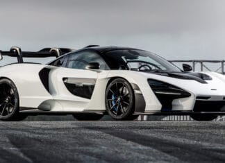 A white McLaren Senna parked on a track with a cloudy sky background, HD Desktop Wallpaper