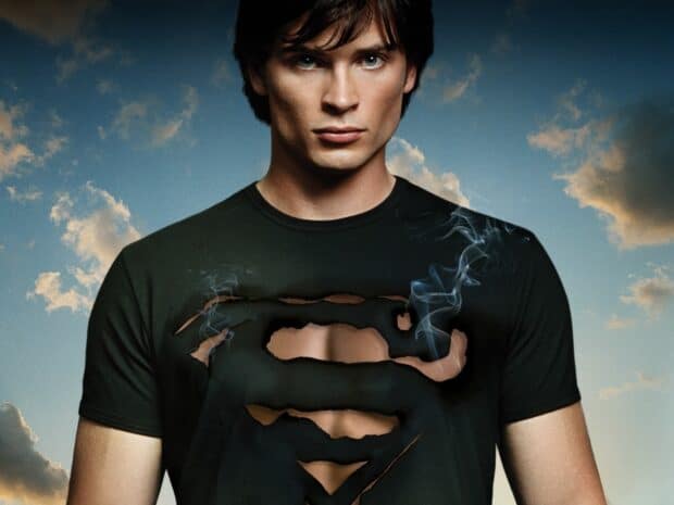A young man wearing a ripped Superman symbol shirt with smoke around it in Smallville TV Series, HD Desktop Wallpaper