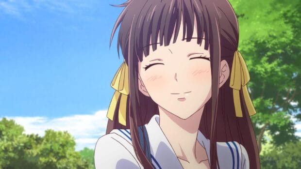 A girl with long brown hair smiles warmly in a sunny outdoor setting from Fruits Basket, HD Desktop Wallpaper