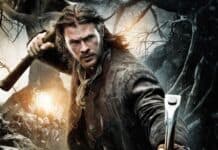 A focused man aims his crossbow in a dark forest scene from Snow White And The Huntsman, HD Desktop Wallpaper