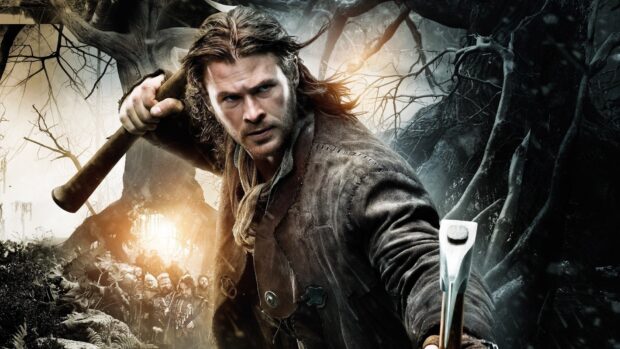A focused man aims his crossbow in a dark forest scene from Snow White And The Huntsman, HD Desktop Wallpaper