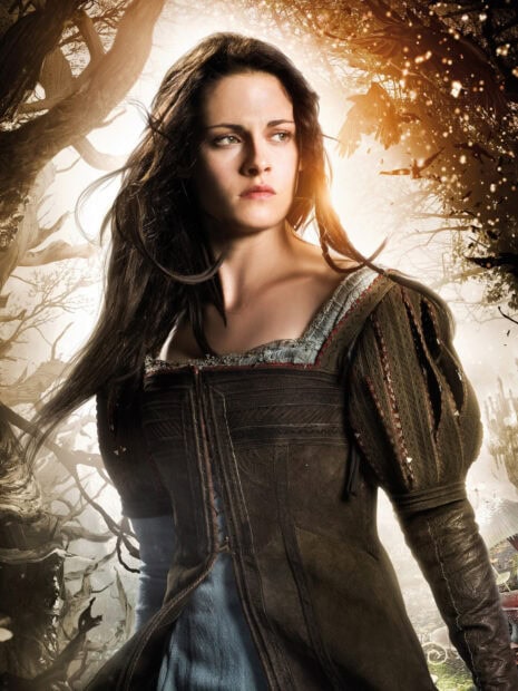 A determined Snow White stands in a magical forest setting from Snow White And The Huntsman, HD Mobile Wallpaper