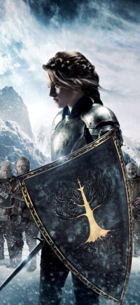 A warrior stands with a shield showing a tree symbol in a snowy mountain scene, HD Phone Wallpaper