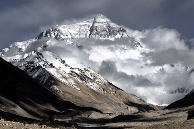 The Tibetan Highlands show majestic snow covered mountains under cloudy skies in this scene, HD Desktop Wallpaper