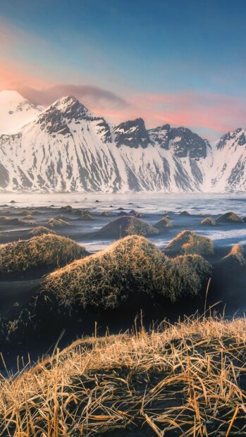 The glacier displays snowy peaks under a colorful evening sky, 4K Phone Wallpaper