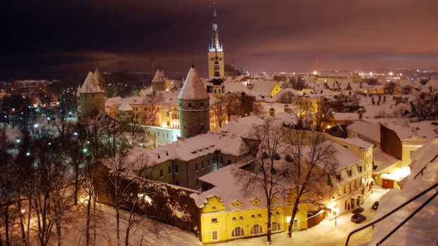 The snow covered old town glows warmly under the night sky in Estonia Wallpapers, HD Desktop Wallpaper