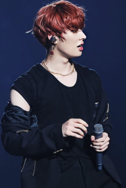 Song Min Gi Ateez is holding a microphone during a live performance, HD Phone Wallpaper