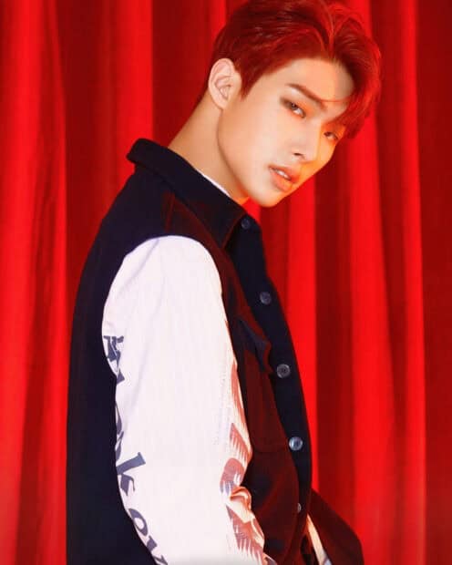 Song Min Gi Ateez stands confidently against a red curtain background, HD Mobile Wallpaper