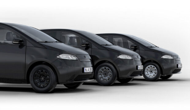 Three black Sono Motors cars are parked side by side in a studio, HD Desktop Wallpaper