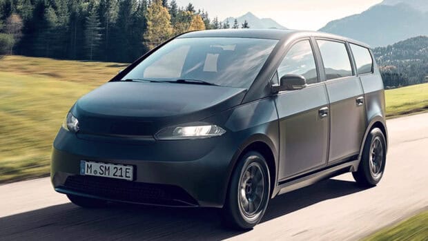 A Sono Motors car drives through a scenic countryside road, HD Desktop Wallpaper