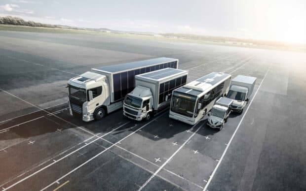 A lineup of Sono Motors electric vehicles parked on a large open space, 2K Desktop Wallpaper