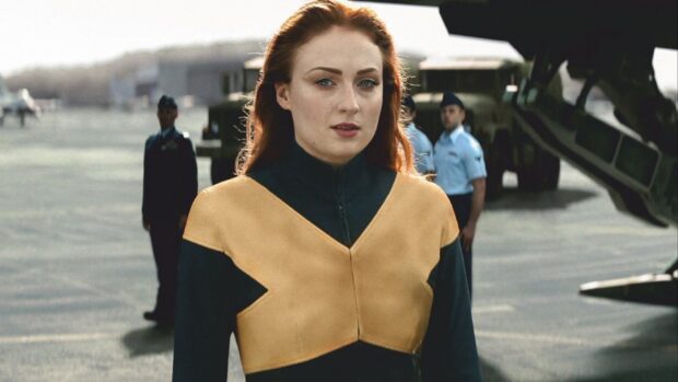 Sophie Turner as Phoenix standing on a military airfield with helicopters and personnel, HD Desktop Wallpaper