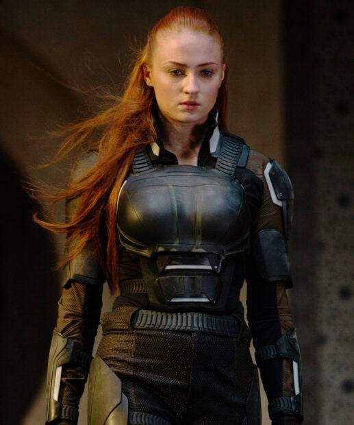 Sophie Turner wears futuristic armor with a serious expression in a dark setting, HD Mobile Wallpaper