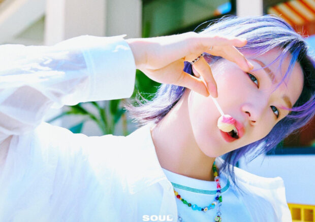 A member of Soul P1Harmony holding a lollipop and looking at the camera, HD Desktop Wallpaper