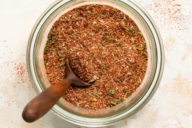 A bowl of spice blend seasoning contains herbs and crushed red pepper flakes, HD Desktop Wallpaper