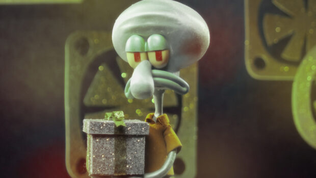 Squidward holding a glittery gift box in a dim room from Squidward Spongebob Squarepants Wallpapers, HD Desktop Wallpaper