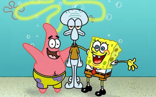 Squidward stands between SpongeBob and Patrick with a cheerful background, 2K Desktop Wallpaper