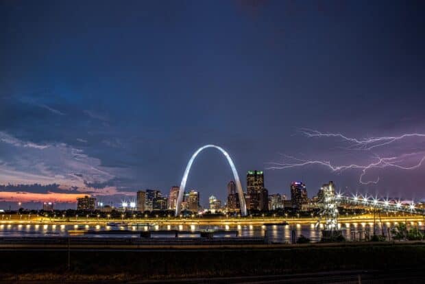 The St Louis skyline is illuminated at night with lightning striking in the background, HD Desktop Wallpaper