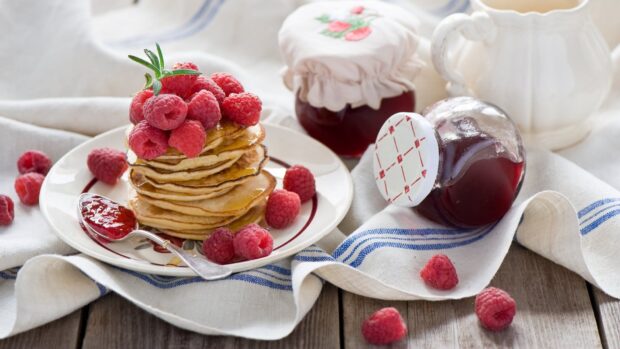 Stack of pancakes topped with fresh raspberries on a plate with jam jars nearby for pancake wallpapers, HD Desktop Wallpaper