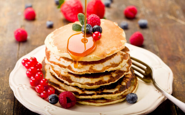 A stack of pancakes topped with syrup and assorted fresh berries on a white plate, 2K Desktop Wallpaper