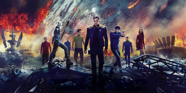 The main characters from Star Trek stand in front of a damaged spaceship on fire, 4K Desktop Wallpaper