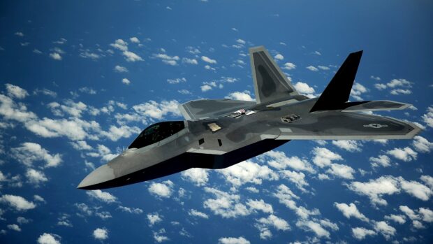 A jet fighter flies high above the clouds in a clear blue sky during flight, 4K Desktop Wallpaper