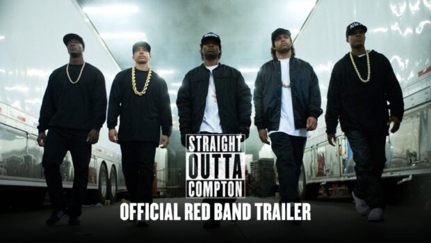 The Straight Outta Compton crew is walking between trucks wearing black outfits and chains, HD Desktop Wallpaper