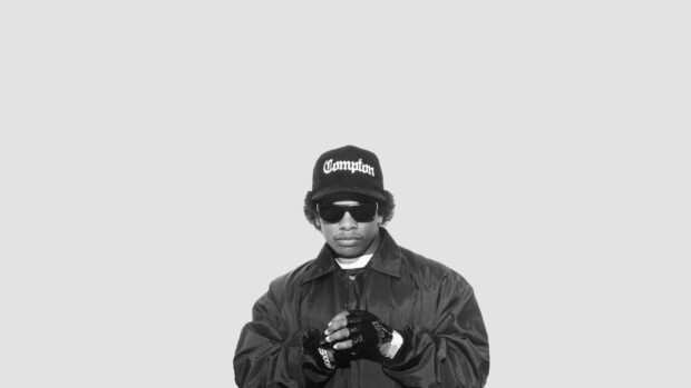 A man wearing a Compton hat and sunglasses is shown in a black and white photo, HD Desktop Wallpaper