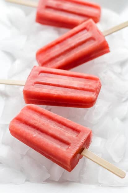 Four red popsicles on a bed of ice showing detailed texture with popsicle wallpapers, HD Mobile Wallpaper