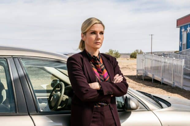 A confident woman stands with arms crossed by a car in a desert setting from Better Call Saul, 2K Desktop Wallpaper