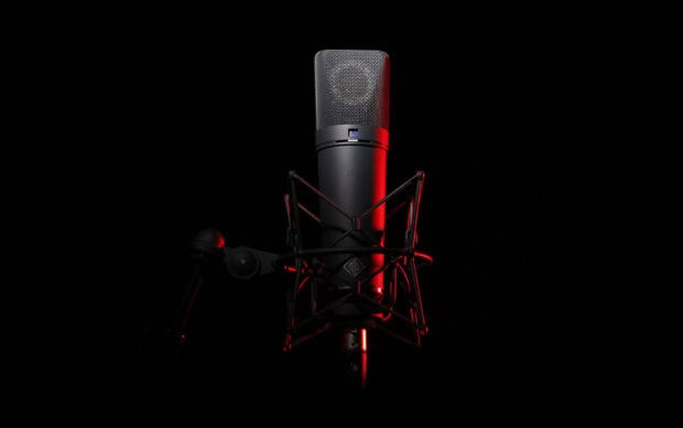 A studio microphone is illuminated with red light against a dark background, HD Desktop Wallpaper