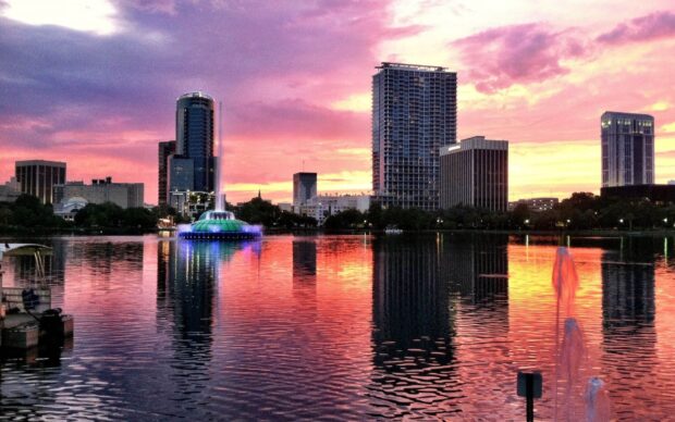 A beautiful view of Orlando with colorful sky and city reflections, HD Desktop Wallpaper