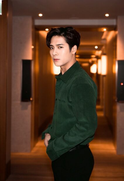 Jackson Wang wallpapers featuring him in a hallway setting, HD Phone Wallpaper