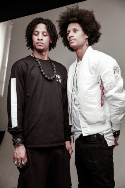 The Les Twins are standing side by side with distinctive hairstyles and casual outfits, HD Desktop Wallpaper