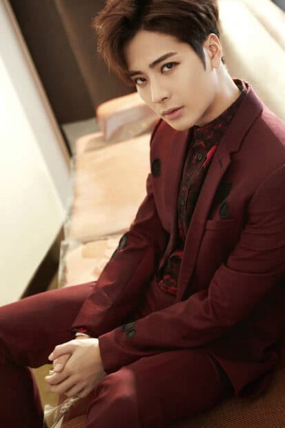 Jackson Wang poses in a red suit with a confident expression, 2K Mobile Wallpaper