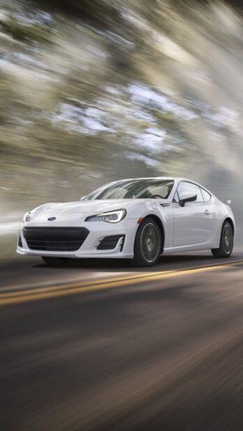 A white Subaru Brz is driving fast on a curved road with blurred trees in the background, HD Phone Wallpaper