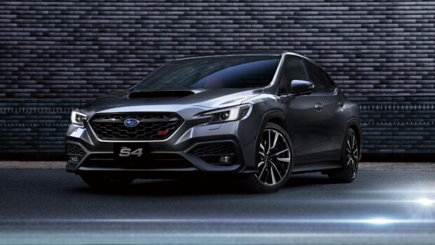 A sleek Subaru Wrx S4 is parked in front of a textured wall under soft lighting, 4K Desktop Wallpaper