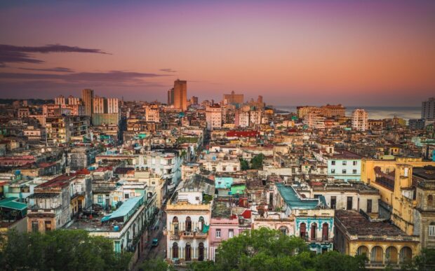 The vibrant old buildings and city streets of Havana Cuba are captured at sunset, HD Desktop Wallpaper