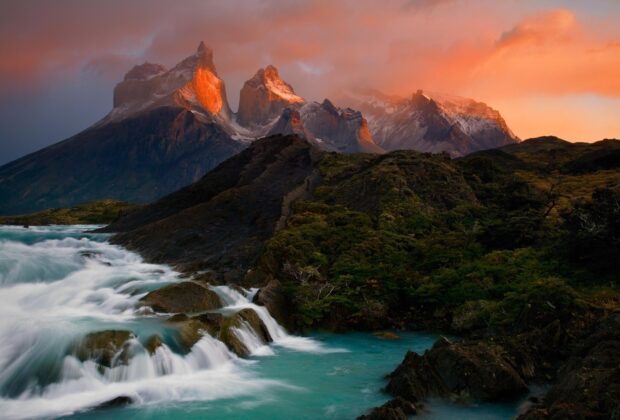 A stunning view of Torres Del Paine National Park with mountains and flowing river at sunset, HD Desktop Wallpaper