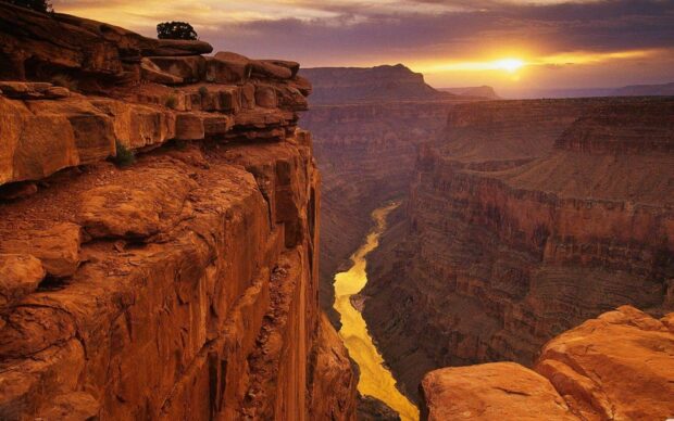 A stunning view of the Grand Canyon with the river glowing under the sunset sky, HD Desktop Wallpaper