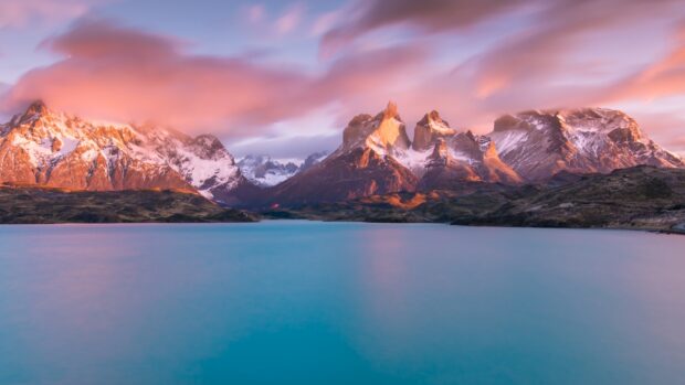 The sun sets behind the peaks of Torres Del Paine National Park with a colorful sky, HD Desktop Wallpaper
