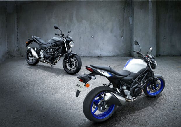 Two Suzuki Sv650 motorcycles parked on a concrete floor with a grey wall background, HD Desktop Wallpaper