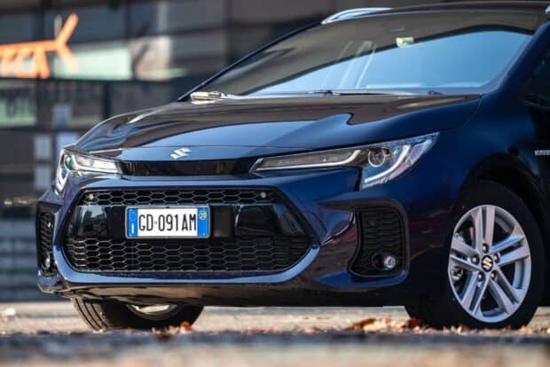 A close up of Suzuki Swace showing its front grille and headlights in detail, 2K Desktop Wallpaper