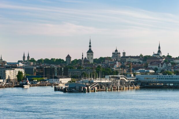 The Tallinn skyline features historic towers and a harbor in Estonia showcasing Estonia Wallpapers, HD Desktop Wallpaper