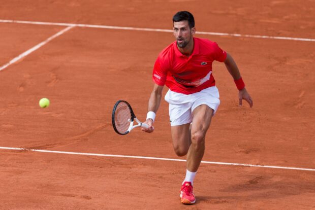 A tennis player is chasing a ball on clay court during the French Open Roland Garros match, 2K Desktop Wallpaper