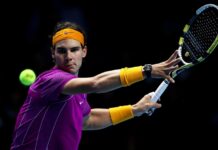 A tennis player is focused on hitting a forehand during a match, HD Desktop Wallpaper