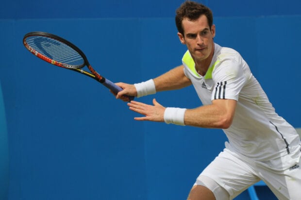 A tennis player is focused on hitting the ball during a match, 2K Desktop Wallpaper